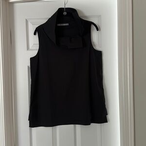 Black sleeveless split neck top. Neck is split at side and can be up or down.